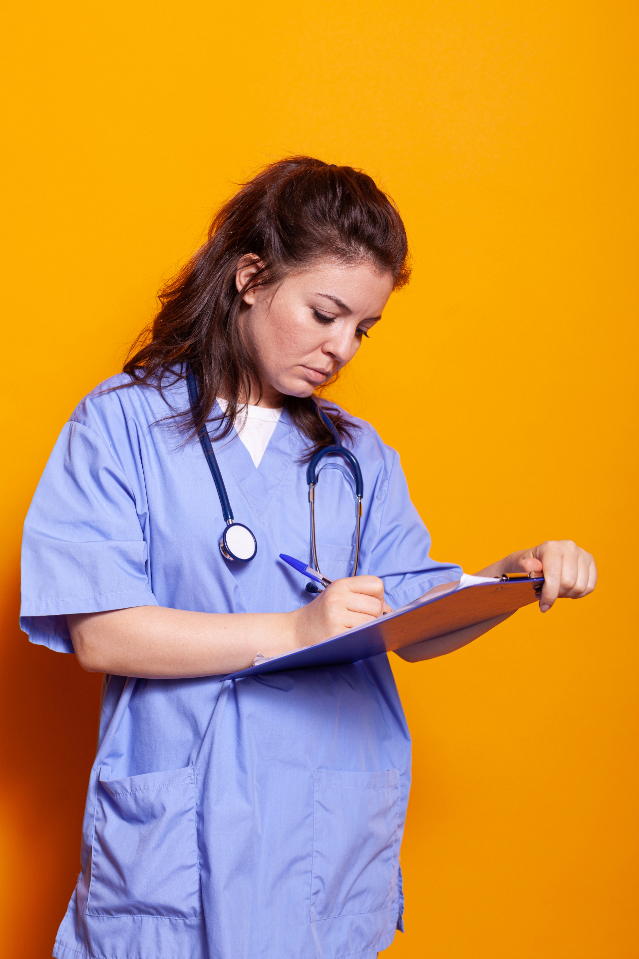 Healthcare professional taking notes